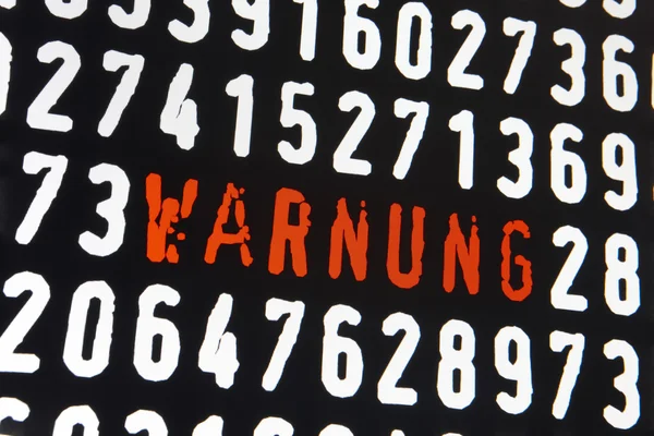 Computer screen with warnung text and numbers on black backgroun — Stock Photo, Image