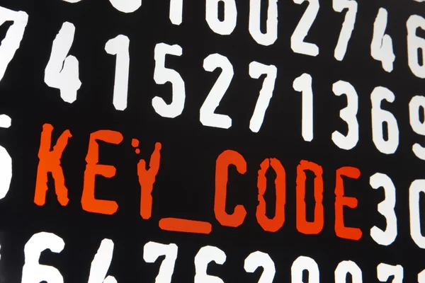 Computer screen with key code text on black background — Stock Photo, Image