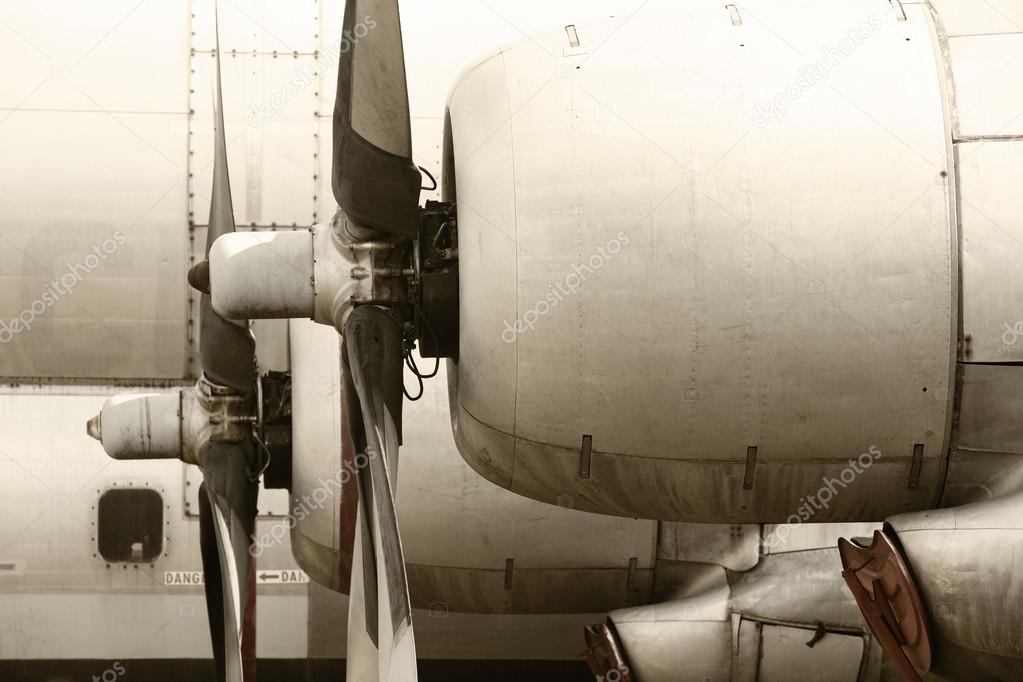 Old aircraft propeller engines airframe and blades in warm tone