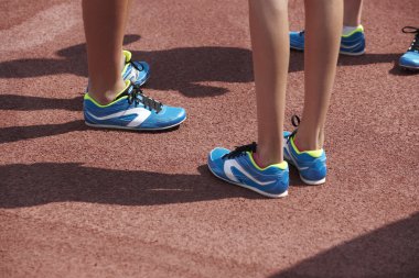 Jumping sport shoes in the athletic field ground