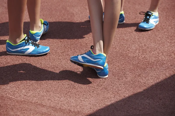 Jumping sport shoes in the athletic field ground — Stock Fotó