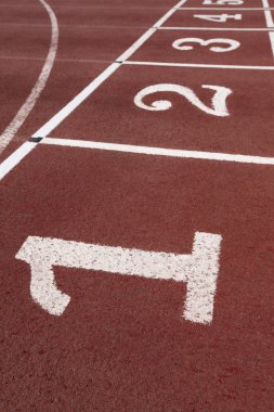 Numbers signpost in an athletic running track