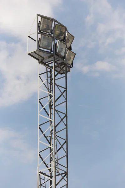 Metallic stadium light post over a blue sky — Φωτογραφία Αρχείου