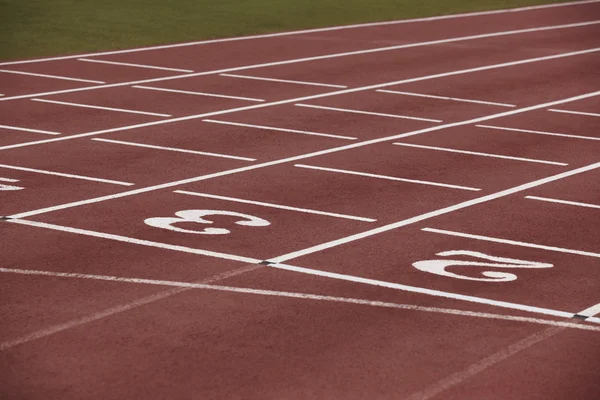 Number three signpost in an athletic running track — Stock Photo, Image