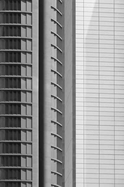 Modern metallic and glass building facade in black and white — 图库照片