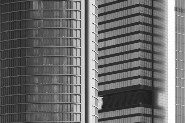 Modern metallic and glass building facade in black and white — Stok fotoğraf