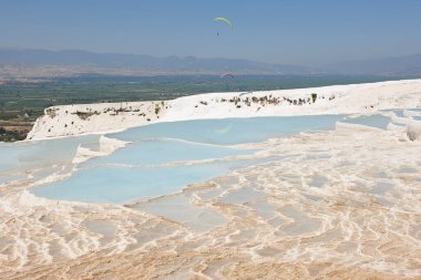 Pamukkale white mineral limestone natural pool. Geology landmark in Turkey