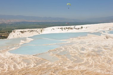Pamukkale white mineral limestone natural pool. Geology landmark in Turkey