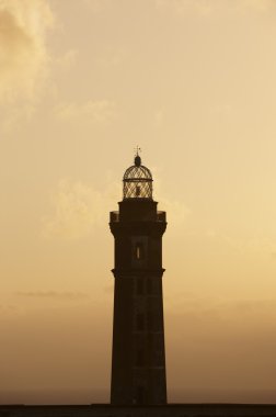 Deniz feneri günbatımı Faial Adası. Ponta dos Capelinhos. Azor