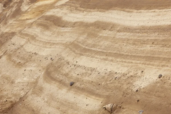 Capas de tierra con rocas en perspectiva. Tonalidad cálida — Foto de Stock