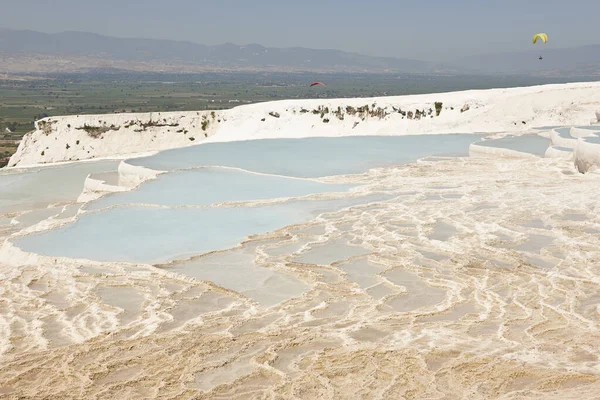 Pamukkale white mineral limestone natural pool. Geology landmark in Turkey