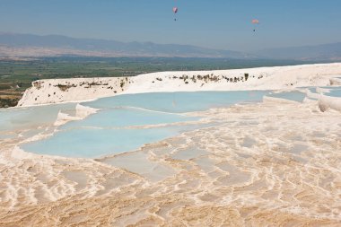 Pamukkale white mineral limestone natural pool. Geology landmark in Turkey