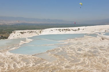 Pamukkale white mineral limestone natural pool. Geology landmark in Turkey
