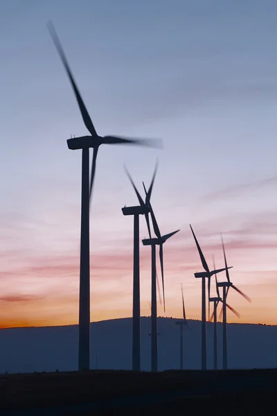 Wind mill farm at dusk. Global warming. Sustanaible energy — Stock Photo, Image