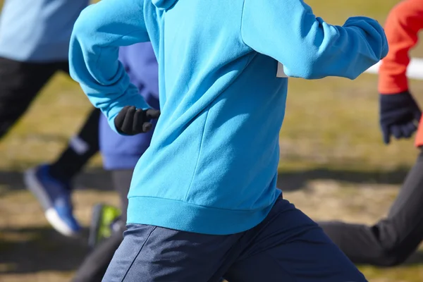 Young athletics runners on a race. Outdoor circuit — Stock Photo, Image