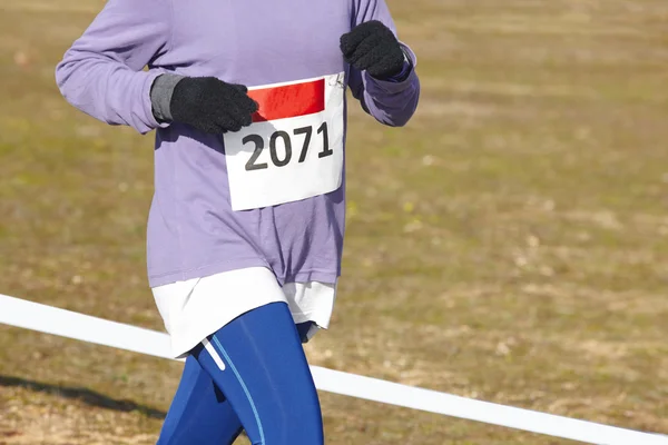 Female athletic runner on a cross country race. Outdoor circuit — Stock Photo, Image