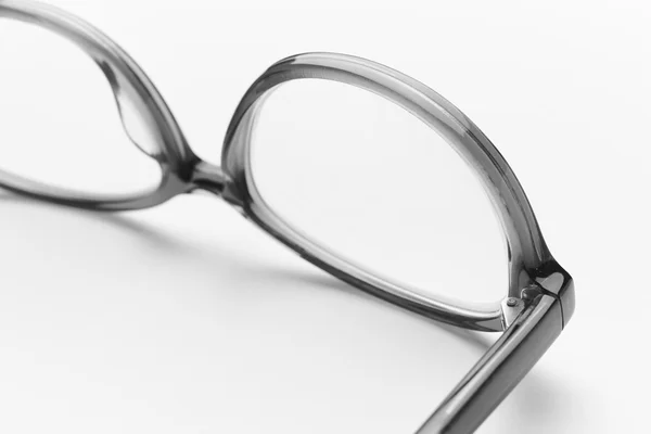 Female eyeglasses macro detail over a white background — Stock Photo, Image