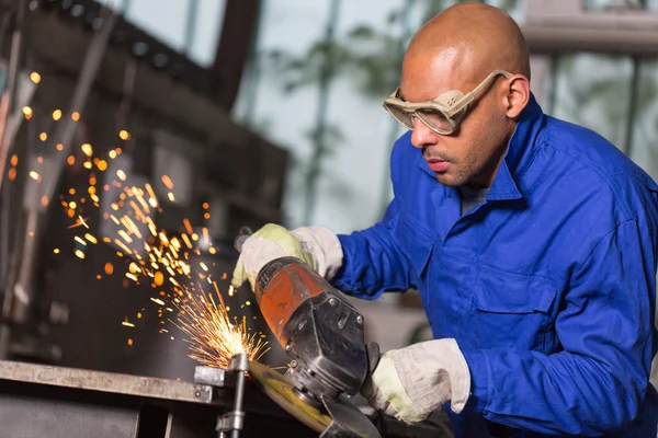 Worker grinding metal with angle gringer — Stock Photo, Image