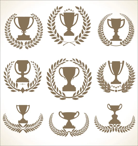 Kopjes van de Award en trofee pictogrammen met laurier kransen colelction — Stockvector