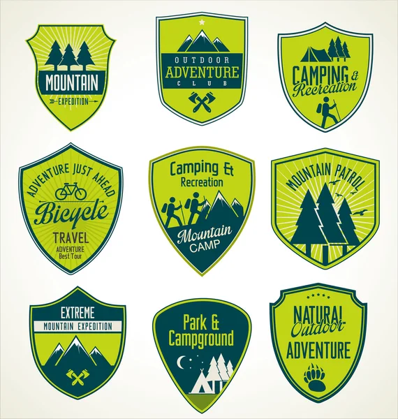 Set of outdoor adventure blue and green retro badges — Stock Vector