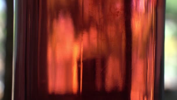 Beautiful abstract colored stains in an iridescent liquid. Blurry yellow, orange, and pink spots. Colored water. — Stock Video
