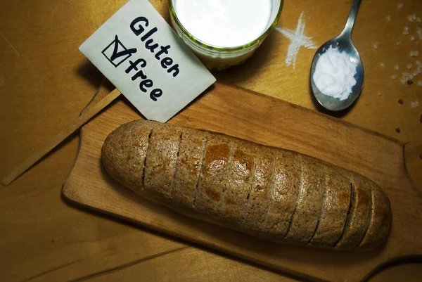 Vegan bread, gluten free and yeast free. Gluten free bread made from a mixture of buckwheat and rice flour, tapioca, kefir and soda rustic table, sliced and ready to serve.