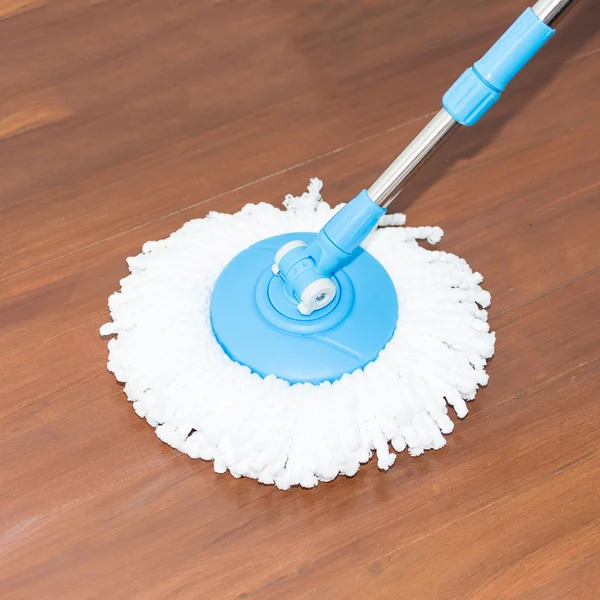 Cleaning wood floor by modern mop. — Stock Photo, Image