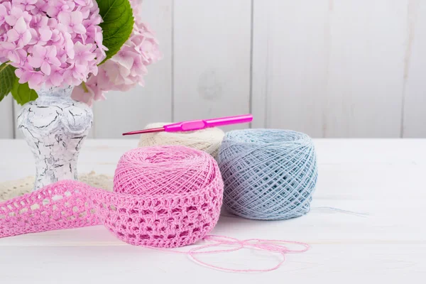 Yarn for crochet and hortensia in vase — Stock Photo, Image