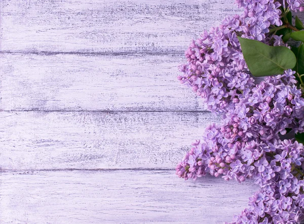 Lilac on background of wooden planks in rustic style — Stock Photo, Image