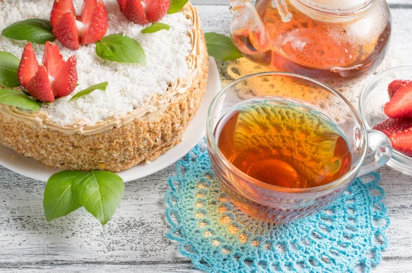 Celebratory cake with strawberries flowers and tea — Stok fotoğraf