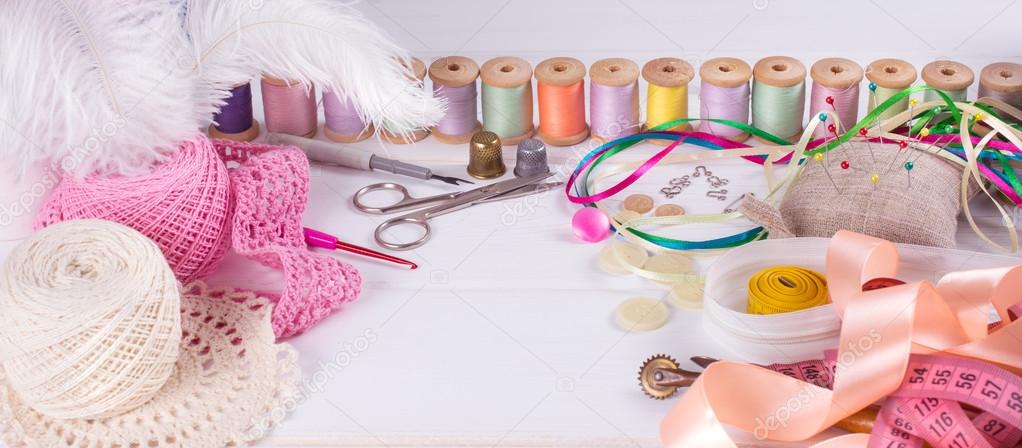 Set for sewing, knitting and needlework on a wooden board  