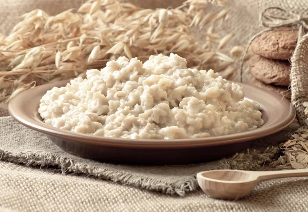 Oatmeal, oat flakes, cookies and spikelets — Stock Photo, Image