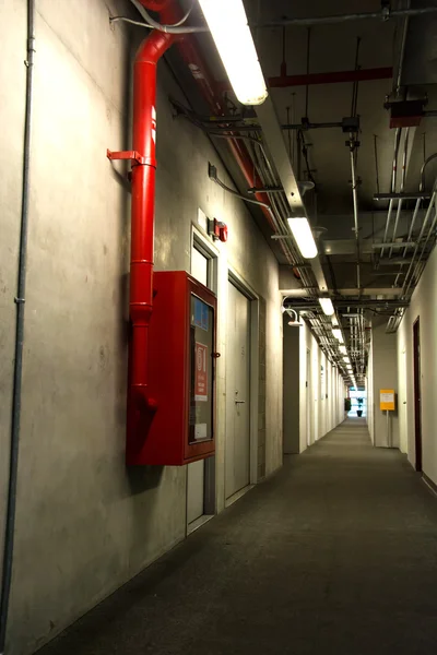 Long corridor interior and fire extinguish equipment — Stock Photo, Image