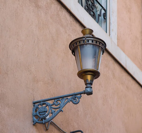 old lantern on the wall in the street