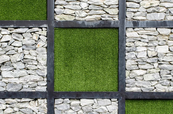 Stone walls and artificial grass — Stock Photo, Image