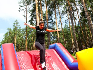 Russia, Volgodonsk - January 18 2015: Jumping on the inflatable slides. Children's attraction.