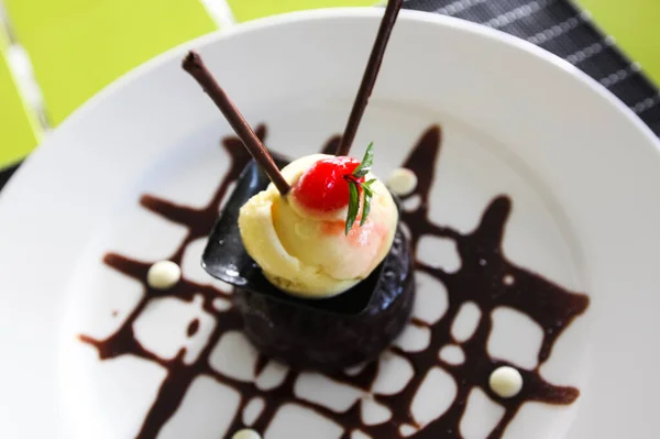 Chocolate fruit dessert on a plate. Table setting in a restaurant.