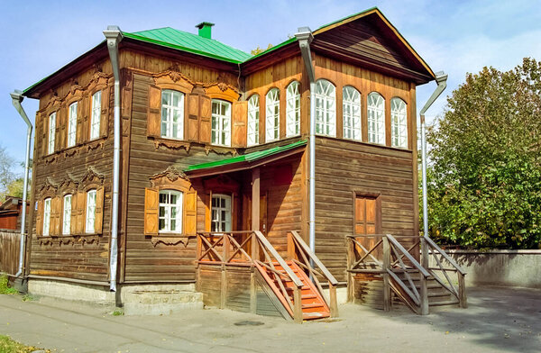 Plinths of windows of wooden houses. Ancient style of decoration of window frames.