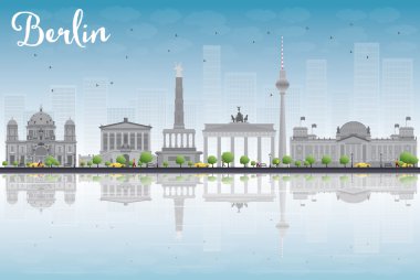 Berlin skyline with grey building, blue sky and reflections
