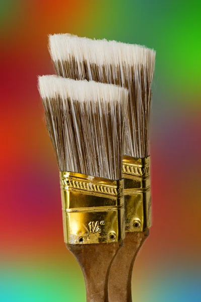 Two brushes against colored background — Stock Photo, Image