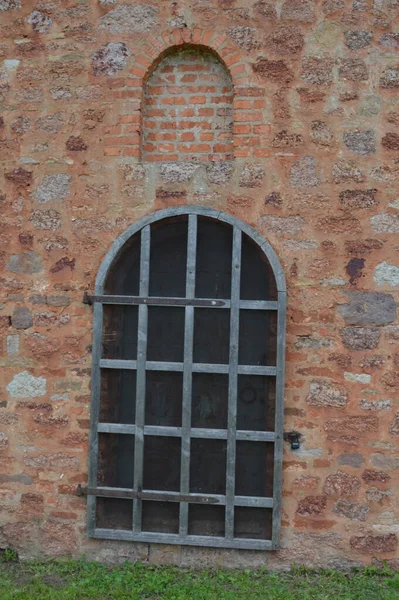 Russia, Novgorod region, Kovalevo, Church of the Transfiguration of the Saviour, door in a brick wall
