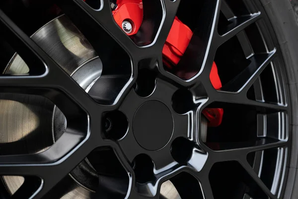 Black Wheel Rim Red Brake Caliper Sport Car Close Stock Photo