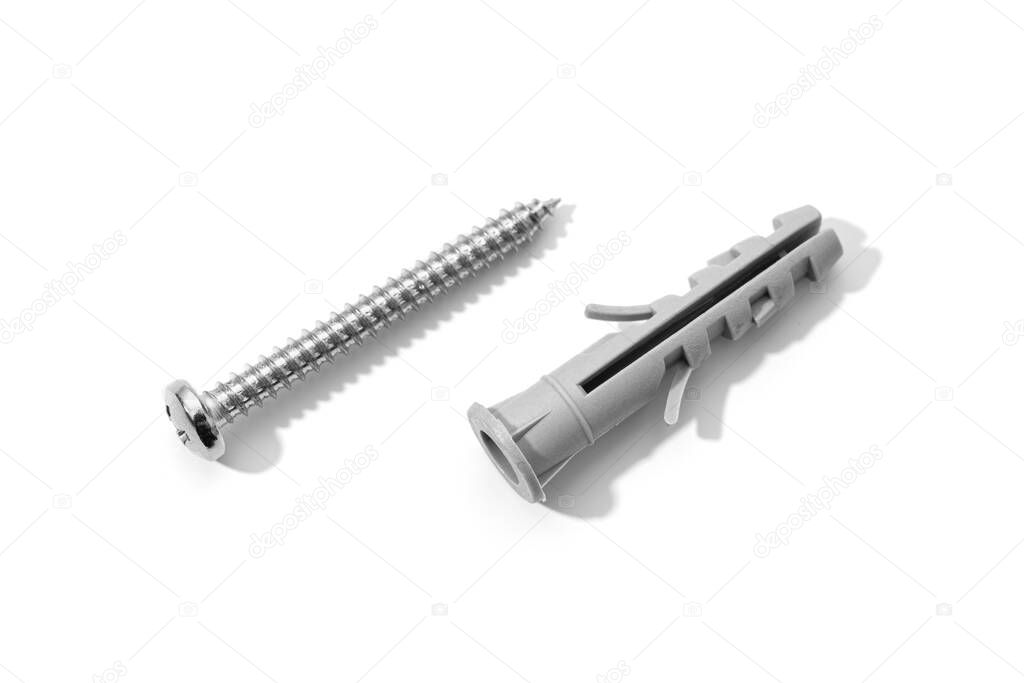 Plastic dowel and screw isolated on a white background. Expansion anchors or fixing dowel with chromed screw