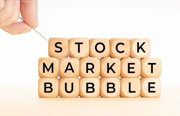 Hand Holding Needle Ready Burst Stock Market Bubble Words Wooden — Stock Photo, Image