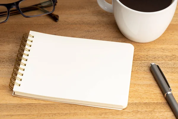 Spiral Notepad Mockup Template Coffee Cup Eyeglasses Wooden Table Empty — Zdjęcie stockowe