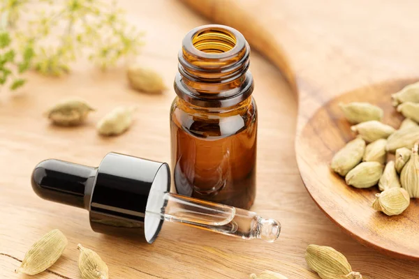Cardamom Essential Oil Bottle Wooden Table Alternative Medicine — Fotografia de Stock