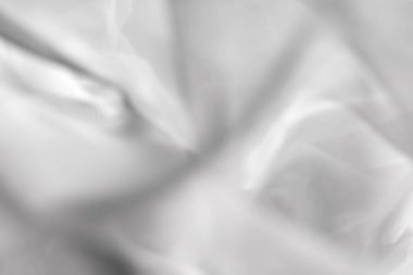 Gri soyut arka plan. Yumuşak ve pürüzsüz arka plan bulanık. Odaklanamayan tül kumaş fotoğrafçılığı