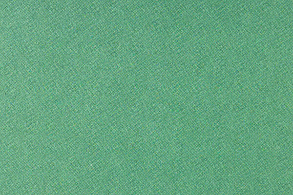 Green offset printed paper background texture. Macro close up. Full frame