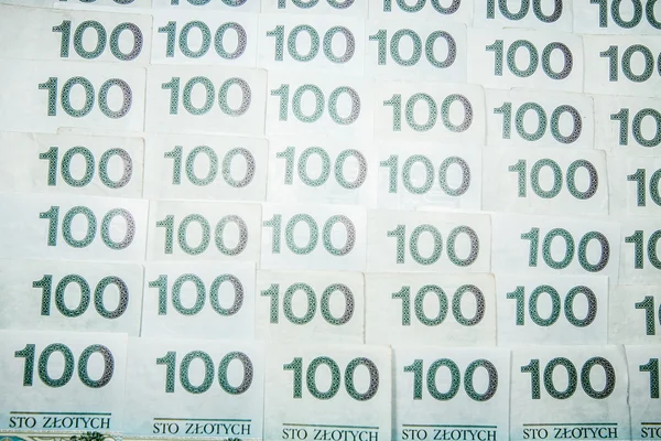 100 zloty bankjegyek - lengyel valuta, mint a háttér — Stock Fotó