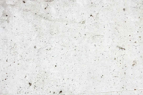 Light concrete with holes as a background — Stock Photo, Image